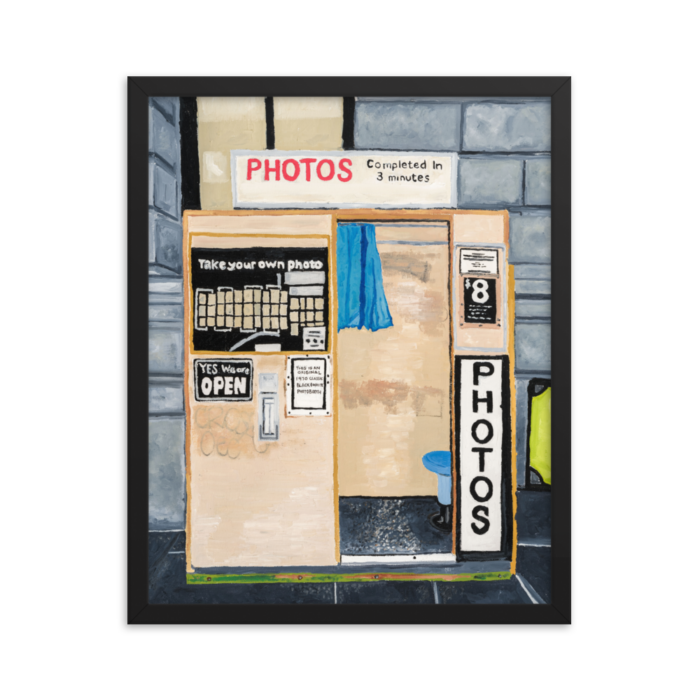 A framed print of Flinders Street photo booth, 16 x 20, black.